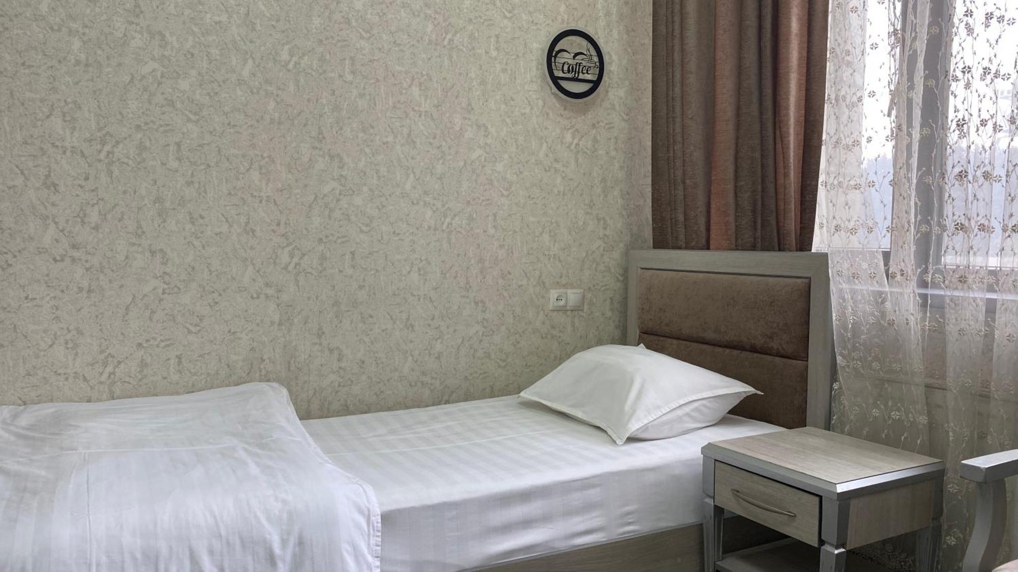 Diyor Hotel Marghilon Екстер'єр фото