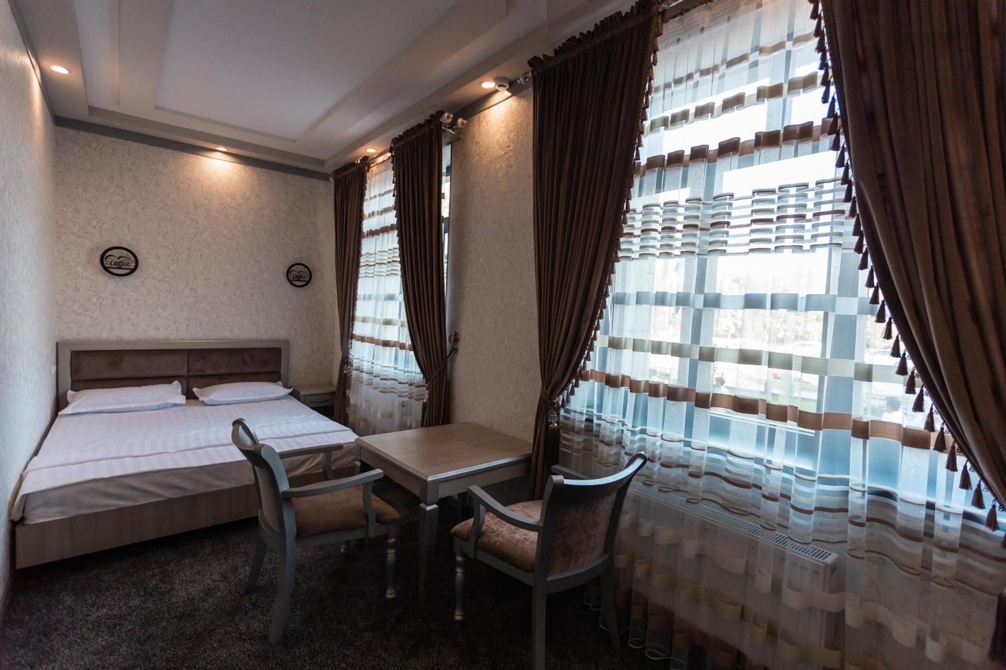 Diyor Hotel Marghilon Екстер'єр фото